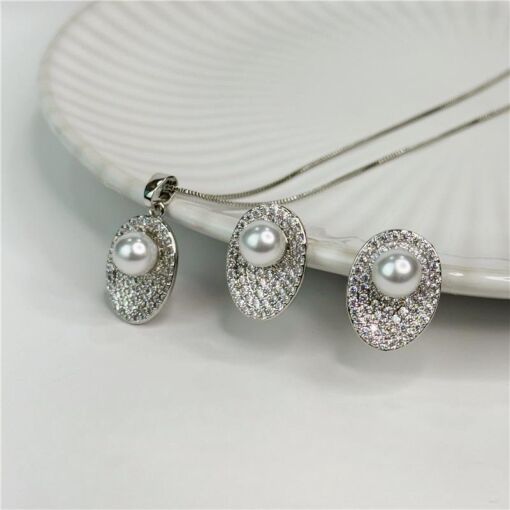CONJUNTO OVAL CRAVEJADO COM PÉROLA