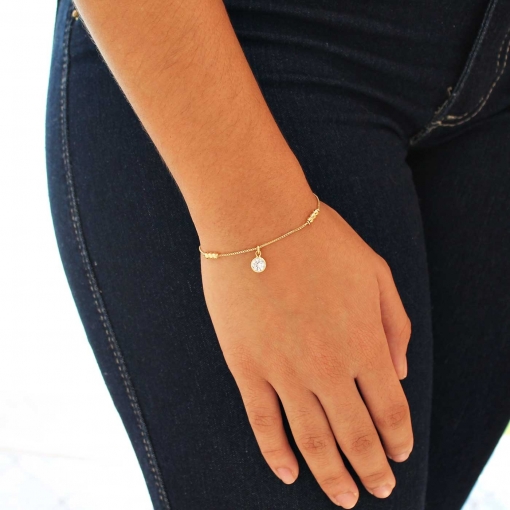 Pulseira com três trios de bolinha e um pingente de zircônia