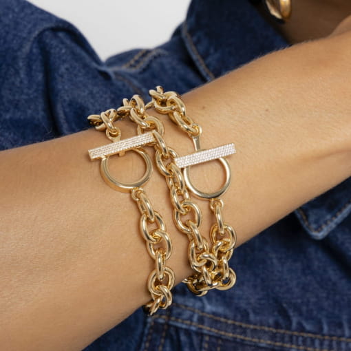 PULSEIRA TRAVA COM ZIRCÔNIAS BRANCAS E ELOS BANHADA A OURO
