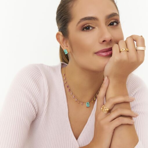 BRINCO COM CRISTAL RETANGULAR BANHADO A OURO