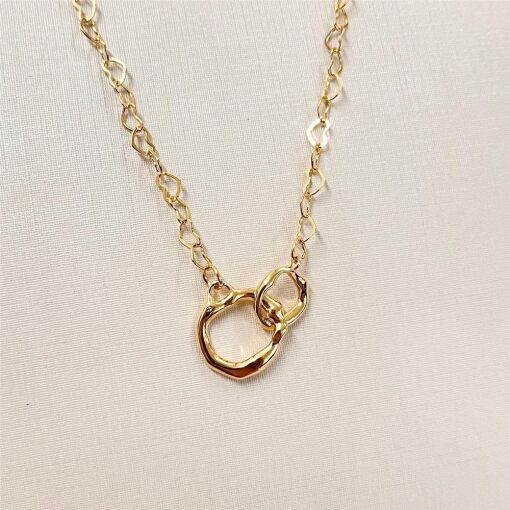 GARG CORAÇÃO C/ DETALHE ORGANICO FOLHEADO A OURO 18K