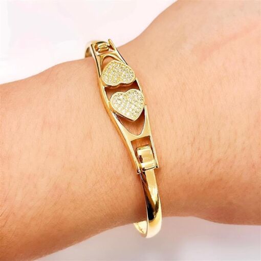 BRACELETE 2 CORAÇÕES CRAV. FOLHEADO A OURO 18K