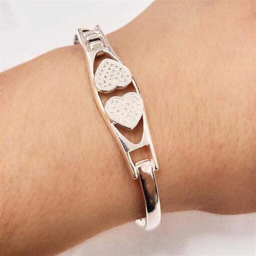 BRACELETE 2 CORAÇÕES CRAV. FOLHEADO A PRATA