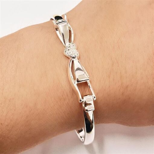 BRACELETE LAÇO C/ CORAÇÃO CRAV FOLHEADO A PRATA