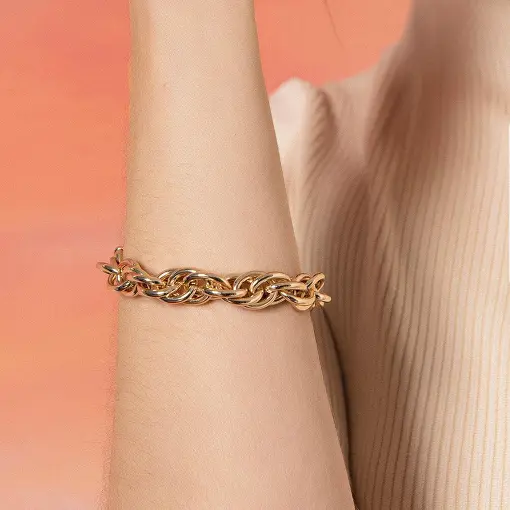 PULSEIRA COM ELOS TRANÇADOS LISOS E FECHO BOIA BANHADA A OURO