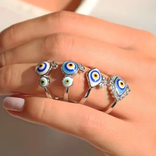 ANEL COM DOIS OLHOS GREGOS ESMALTADOS PRATA RODINADA