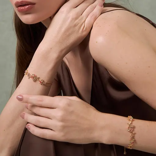 PULSEIRA COM FLORES  E BORBOLETAS BANHADA A OURO