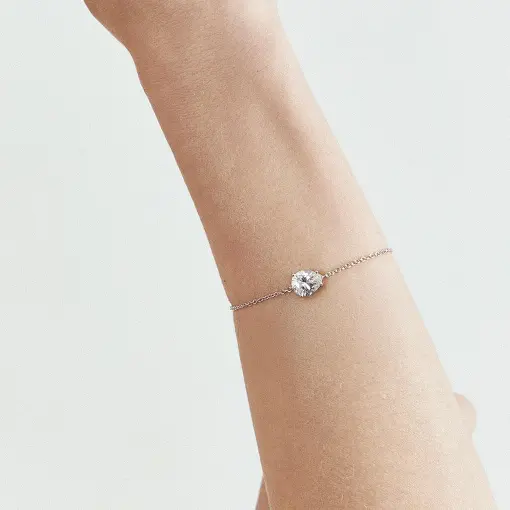 PULSEIRA COM CRISTAL DE GOTA PRATA RODINADA