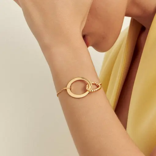 PULSEIRA COM OVAIS LISOS E TRANÇADO BANHADA A OURO